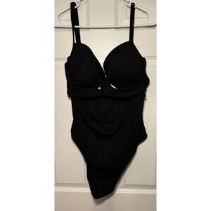 Black women’s swimsuit. Cut-outs.‎ Size 2XL. Great condition.